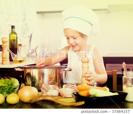 Baby girl cooking with meat 37864257