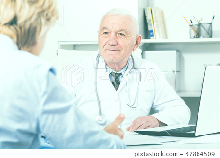 Male doctor with female client Male doctor with female client 37864509