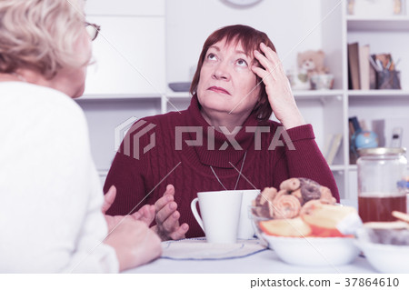 Old women in the kitchen quarrel 37864610