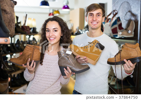 Young couple in a shoe store. 37864750