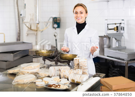 Portrait of female with packing of turron in food factory 37864850