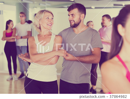 smiling young adults dancing salsa smiling young adults dancing salsa 37864982