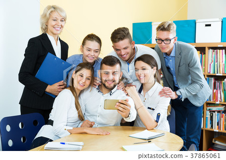students and female professor taking selfie 37865061