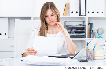 Worried young female in office 37865062