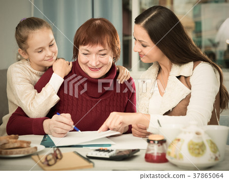 Happy family working with papers Happy family working with papers 37865064