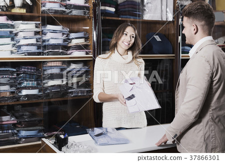 Female seller in clothes store 37866301