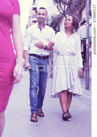Angry female is jealousying because her boyfriend is staring on 37866517