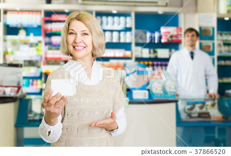 Portrait of mature woman at the pharmacy Portrait of mature woman at the pharmacy 37866520