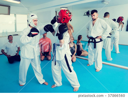 Man coach watches the sparring Man coach watches the sparring 37866560