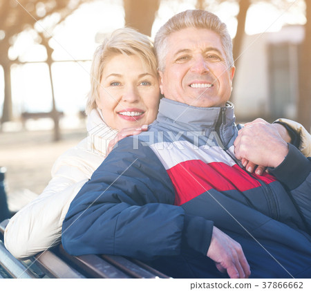 Smiling mature couple relaxing in park 37866662