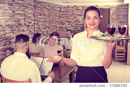 Female waiter showing country restaurant 37866784