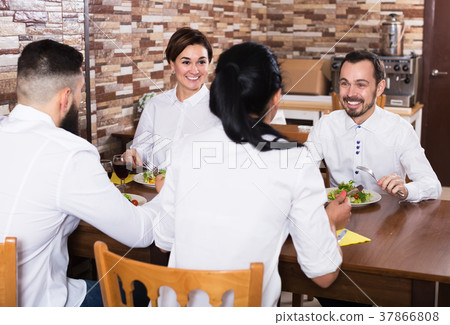 Company of friends in restaurant Company of friends in restaurant 37866808