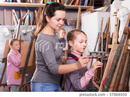 Teacher helping teenage students Teacher helping teenage students 37866930