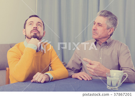 Mature father and son serious talk Mature father and son serious talk 37867201