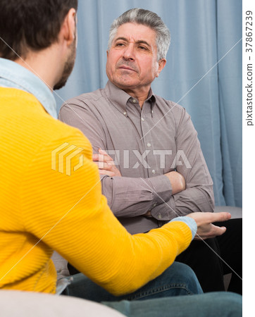 Adult father and son solve problems Adult father and son solve problems 37867239