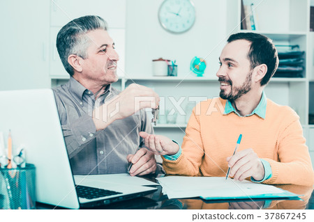 Mature man and agent sign rental agreement 37867245