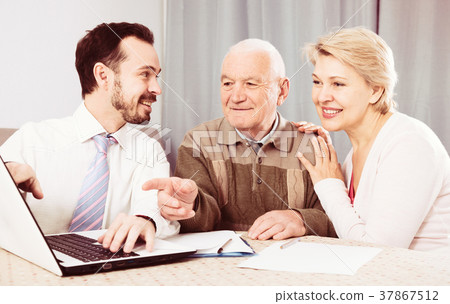 Woman and old man consider contract 37867512