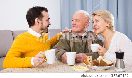 Smiling family having breakfast 37867552