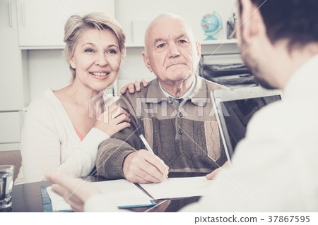 Old man and woman in social department Old man and woman in social department 37867595