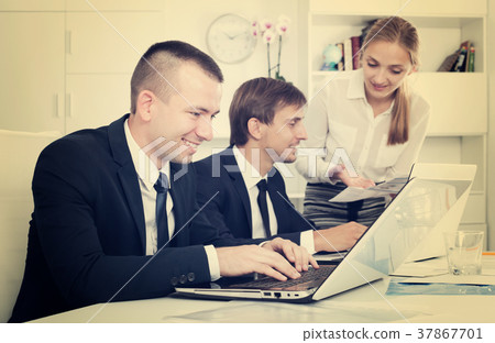 Business colleagues chatting about work task Business colleagues chatting about work task 37867701