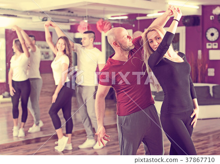 Couples having dancing class Couples having dancing class 37867710