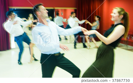 Motion blur of dancing couples Motion blur of dancing couples 37867730