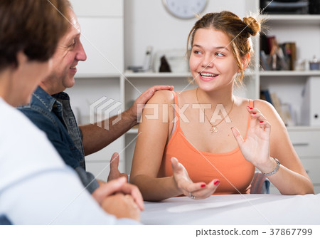 Happy family is talking about life at the table Happy family is talking about life at the table 37867799