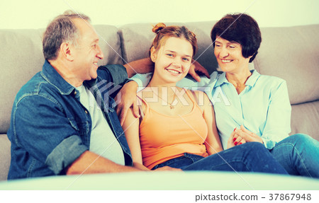 Portrait of happy family on sofa Portrait of happy family on sofa 37867948