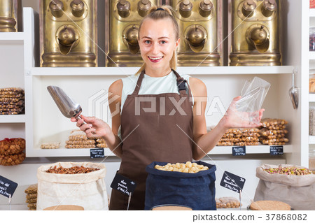 Young woman is offering nuts 37868082