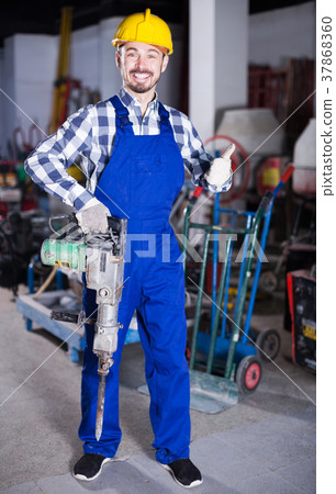 Worker work with demolition hammer Worker work with demolition hammer 37868360