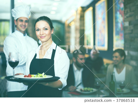 Waitress with chef in restaurant 37868518