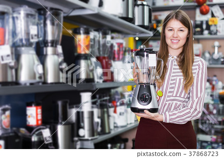 saleswoman offering blender saleswoman offering blender 37868723