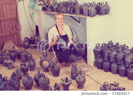 female with black-glazed ceramic 37868917