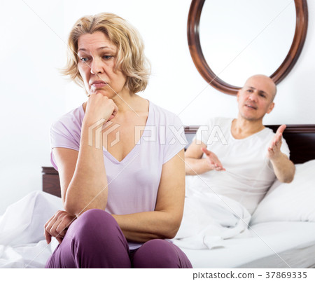 Mature couple quarrels in bed 37869335