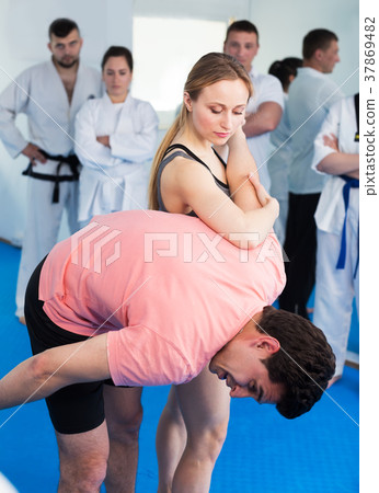 Female coach showing painful hold 37869482