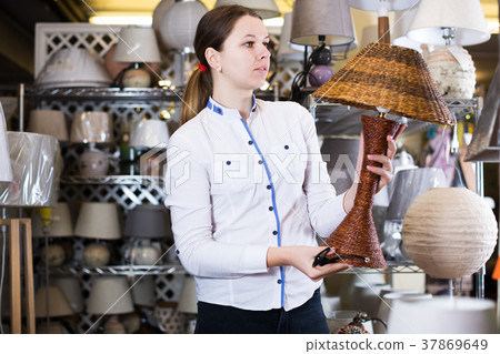 Woman buying new lamp Woman buying new lamp 37869649