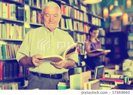 Mature man is choosing book Mature man is choosing book 37869660