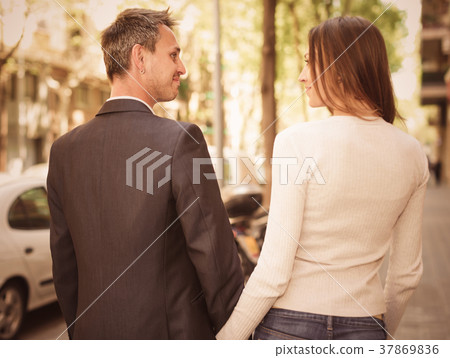 Couple strolling together Couple strolling together 37869836