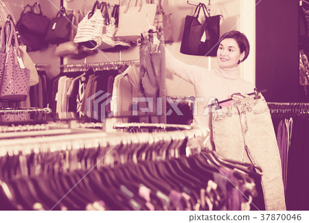 Adult woman deciding on new jeans 37870046