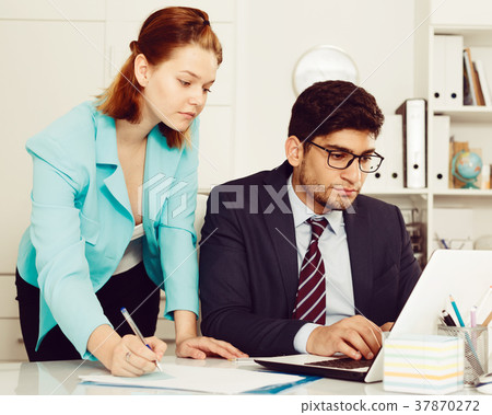 Business partners working in office Business partners working in office 37870272