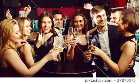 Cheerful working team are resting and drinking cocktails 37870575