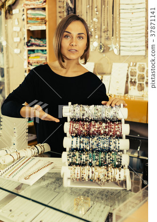 woman offering to buy stylish bracelets woman offering to buy stylish bracelets 37871141