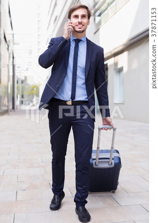 Portrait of businessman talking on the phone Portrait of businessman talking on the phone 37871153