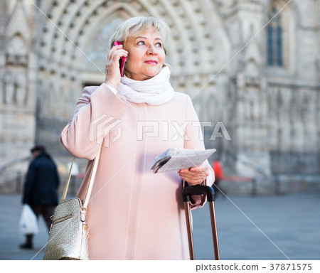 female tourist talking on phone 37871575