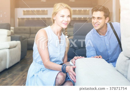 couple are choosing comfortable sofa 37871754
