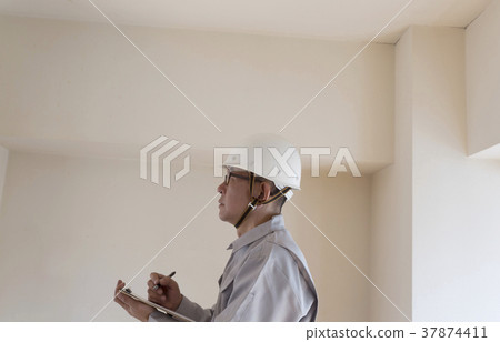 Workers in helmets General-purpose materials for housing survey before renovation Workers in helmets General-purpose materials for housing survey before renovation 37874411