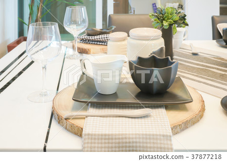 pottery cups on wooden cutting plate 37877218
