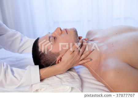 doctor cosmetologist doing facial massage men spa doctor cosmetologist doing facial massage men spa 37877707