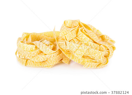 pile of uncooked fettuccine on white background pile of uncooked fettuccine on white background 37882124