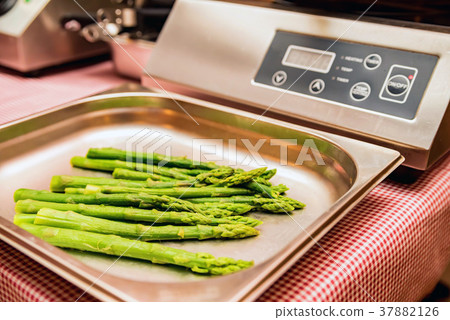Close up green asparagus on scales Close up green asparagus on scales 37882126